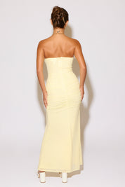 Woman wearing a yellow dress on a white background