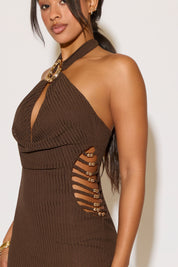 Brown halter neck dress with cut-out design on a white background