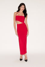 Woman wearing a red dress with cut-out design on a white background