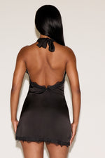 Black satin nightgown with lace trim on a white background