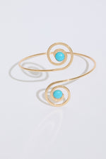 SWIRLS WITH JEWELS METAL ARM CUFF on a white background.