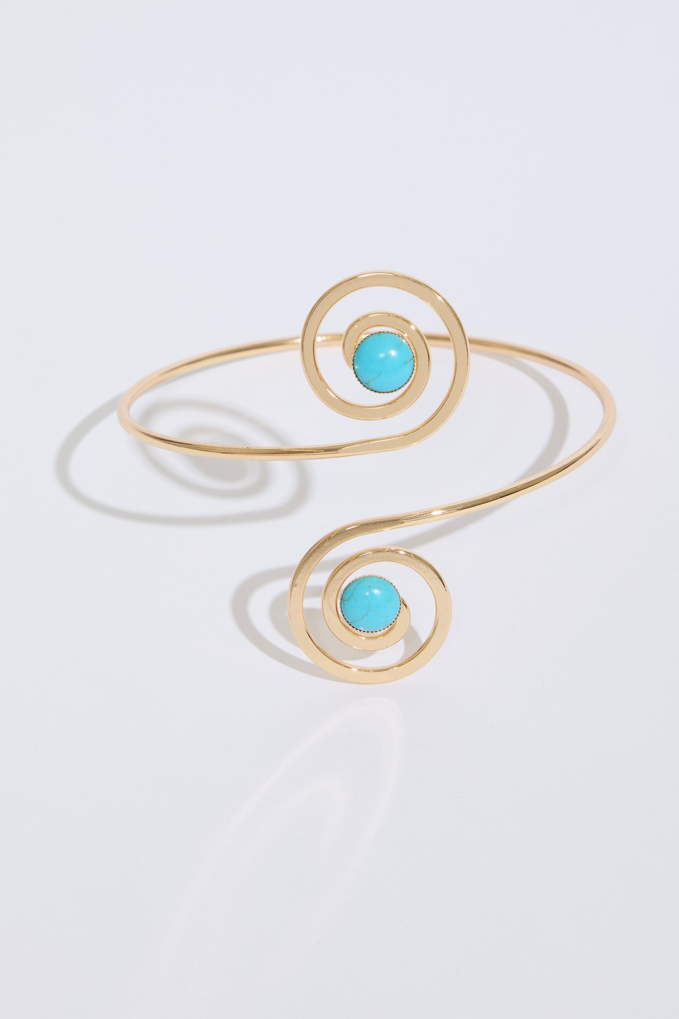 SWIRLS WITH JEWELS METAL ARM CUFF on a white background.