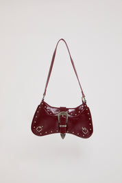 VEGAN LEATHER BENT HOBO BAG W STUDS & BUCKLES