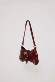 VEGAN LEATHER BENT HOBO BAG W STUDS & BUCKLES