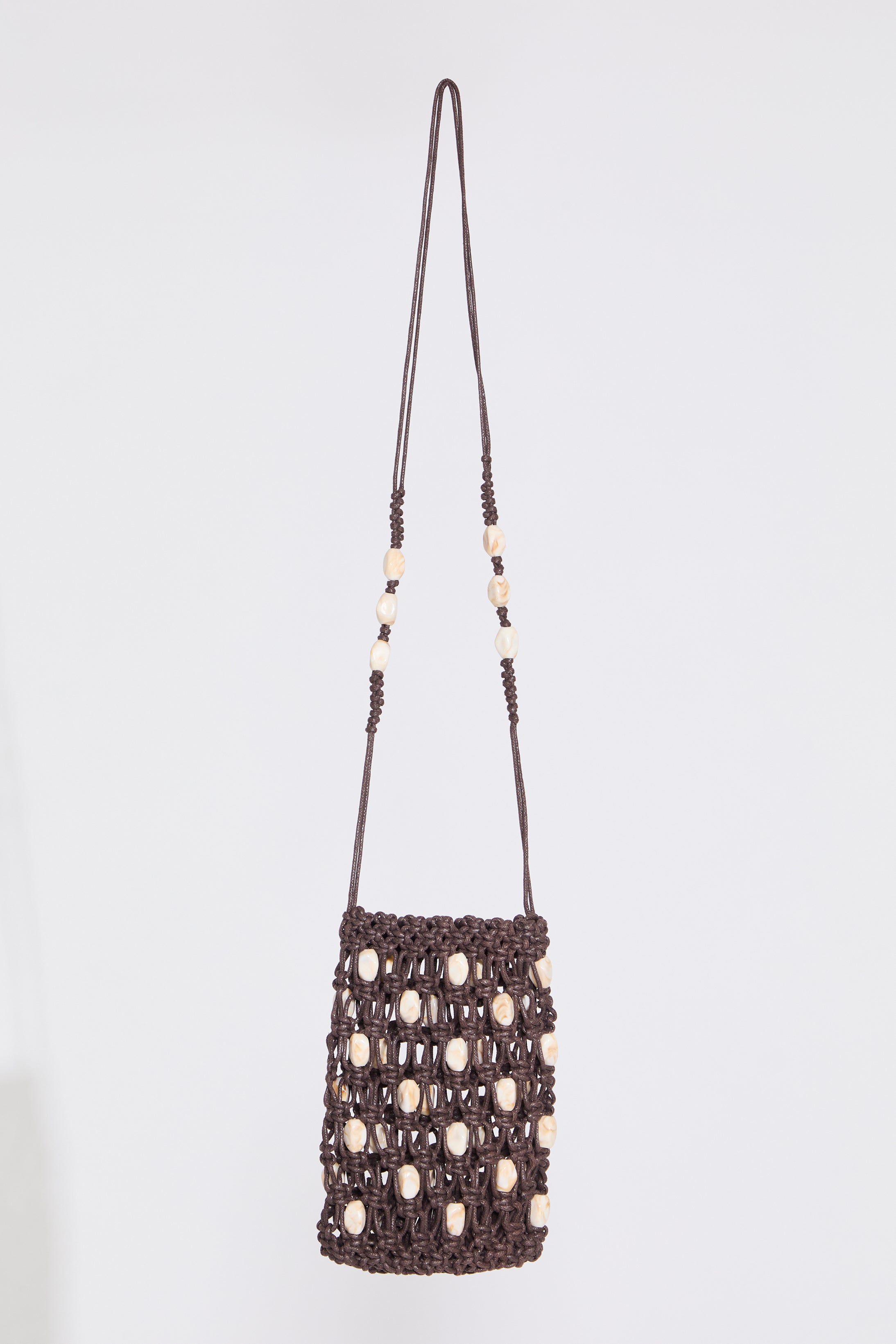 SHELL EMBELLISHED WOVEN DRAWSTRING BAG on a white background.