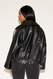 Person wearing a black leather jacket on a white background