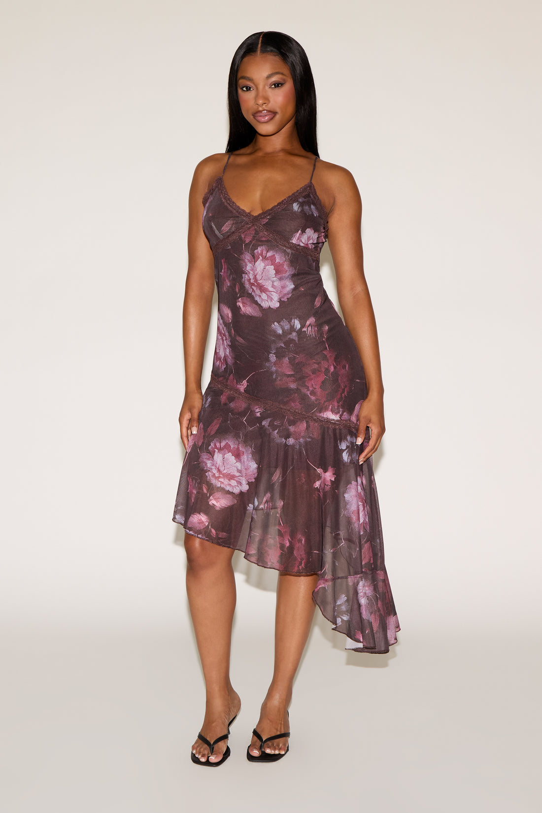 Woman wearing a floral dress on a white background