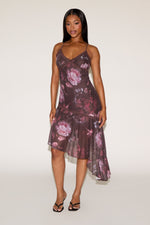 Woman wearing a floral dress on a white background