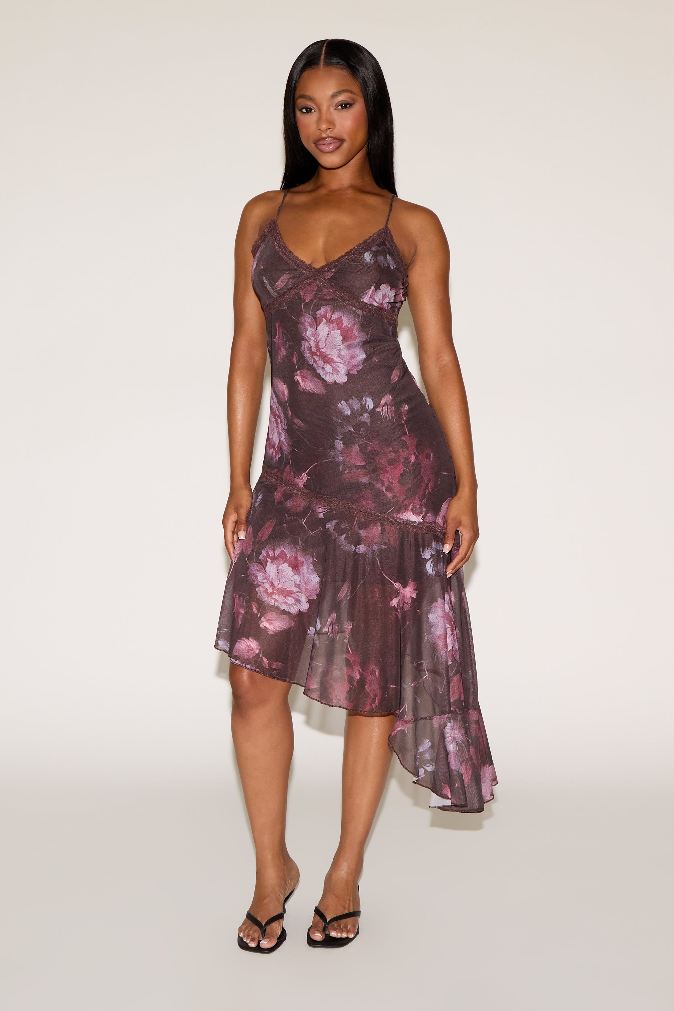 Woman wearing a floral dress on a white background