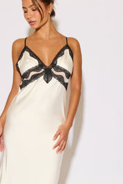 Woman wearing a white satin dress on a white background