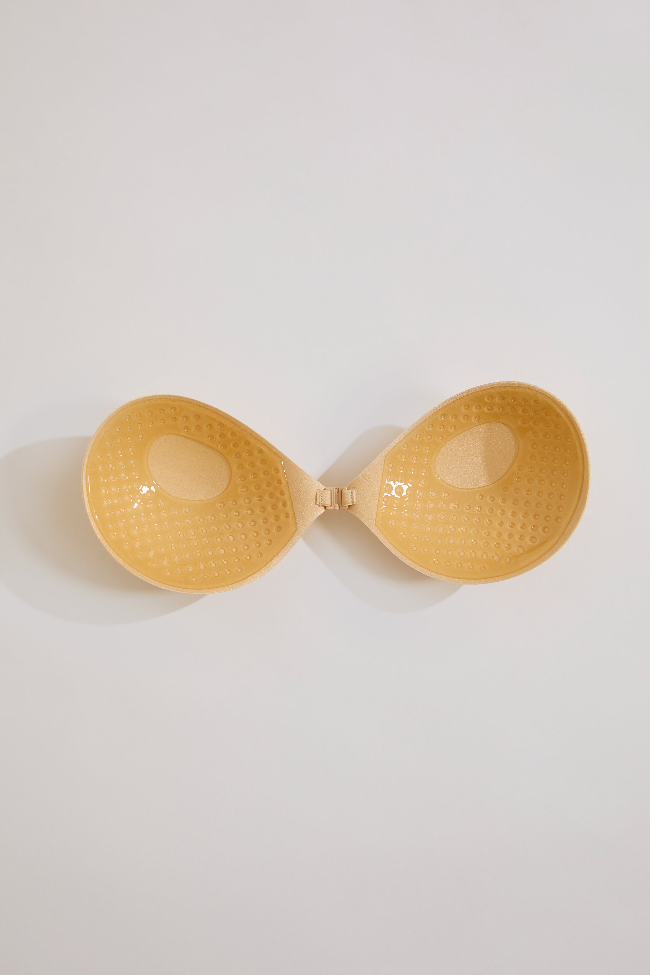 Yellow bra on a light gray background