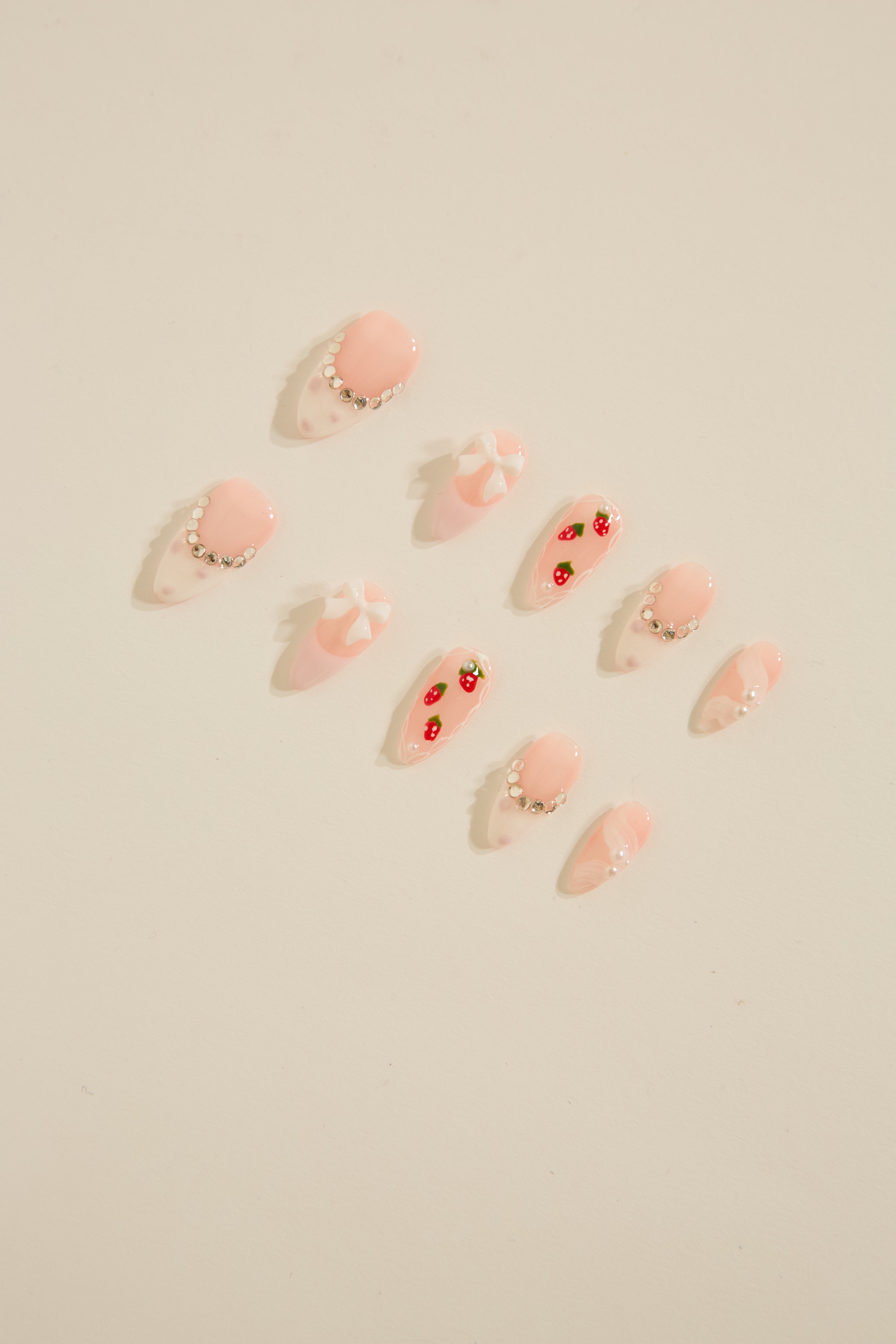 MULTI DESIGN & COLOR JEWELED ALMOND NAILS