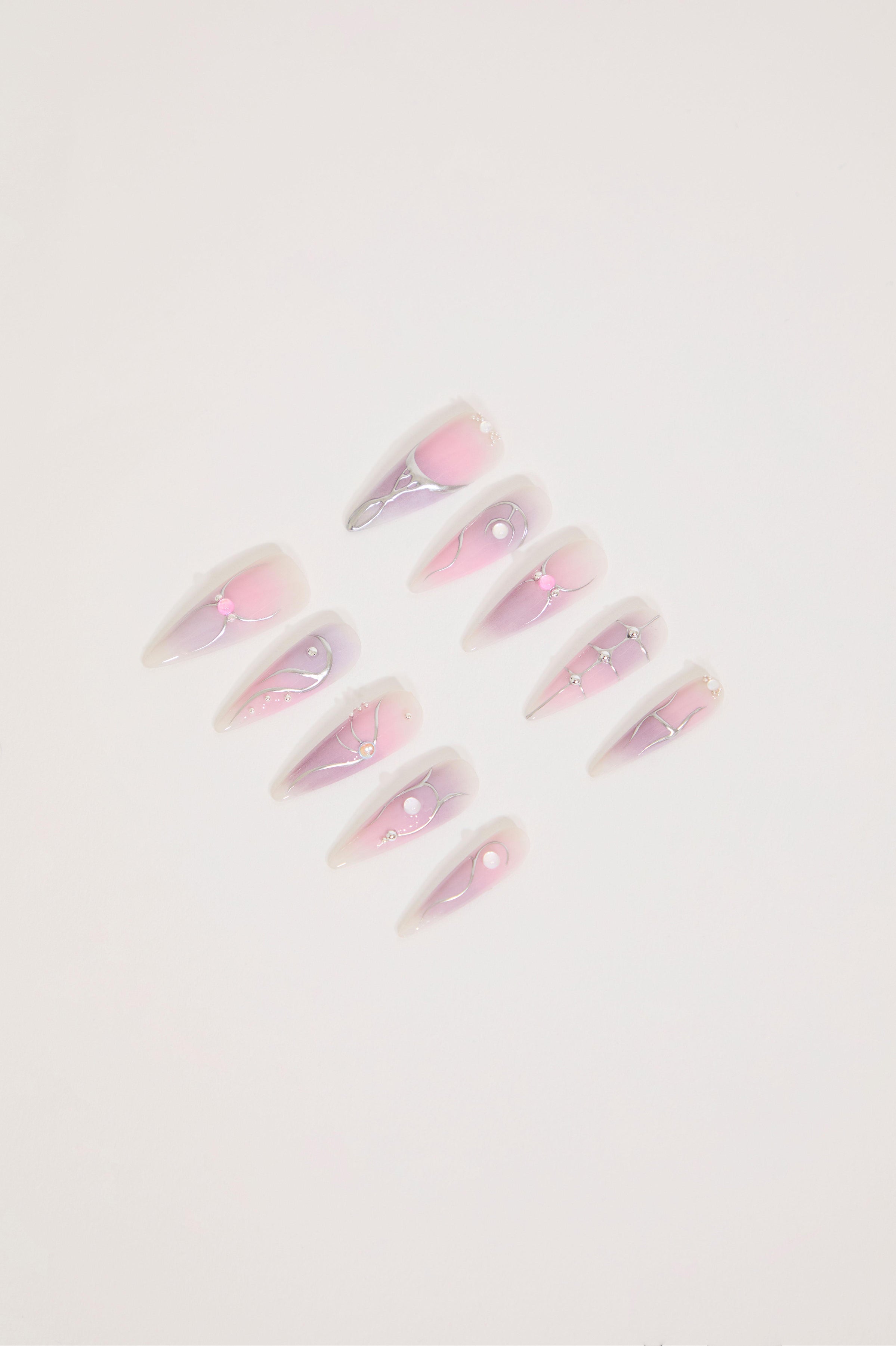LONG IRIDESCENT STILETTO NAILS WITH JEWELS