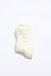 White sock with a brand label on a white background