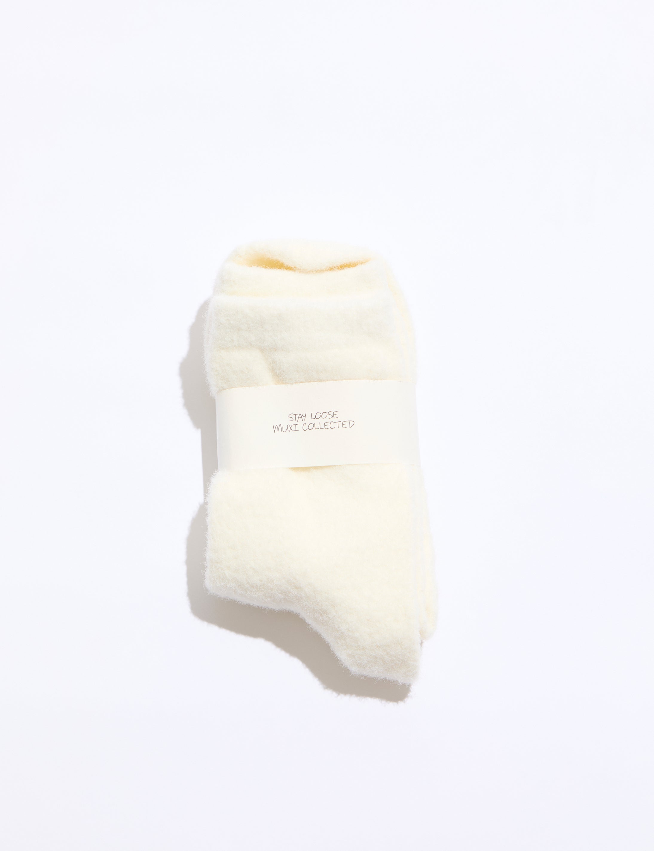 White sock with a brand label on a white background