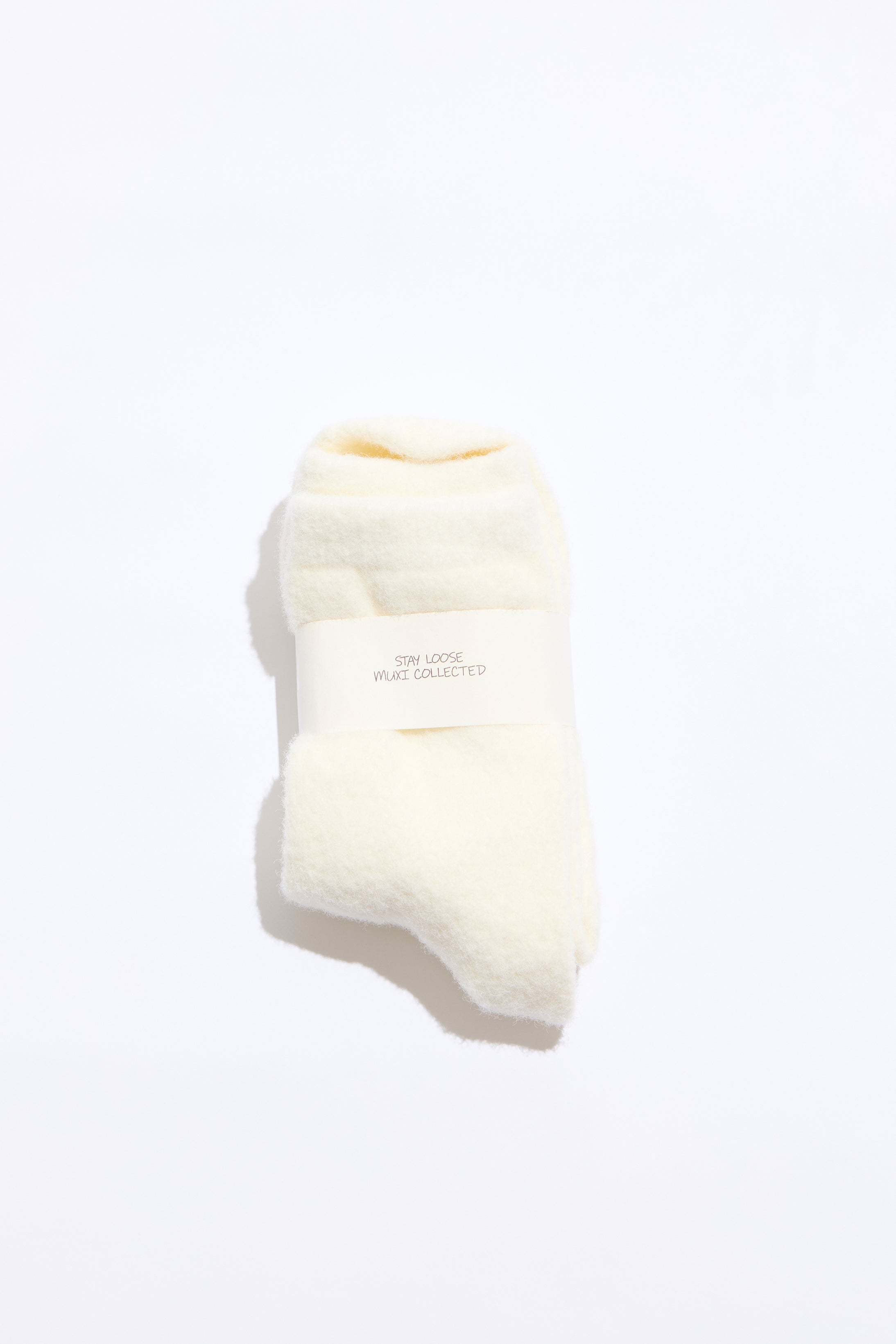 White sock with a brand label on a white background
