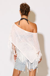 Model wearing a white shawl on a white background