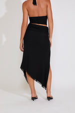 Black strapless dress with cut-out design on a white background