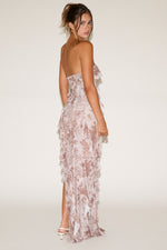 Woman wearing a floral lace dress on a white background