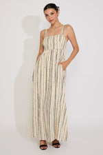 Woman wearing a striped dress on a white background