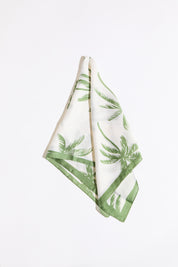 Palm tree and border silk scarf on a white background.