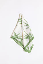 Palm tree and border silk scarf on a white background.