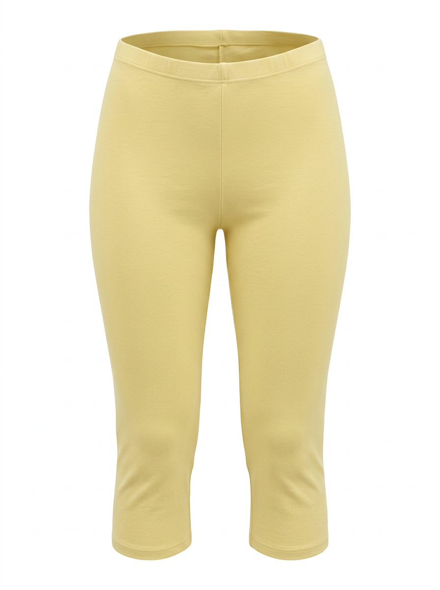 Ghost image of a light-yellow HIGH WAISTED BASIC CAPRI LEGGING on a white background. 