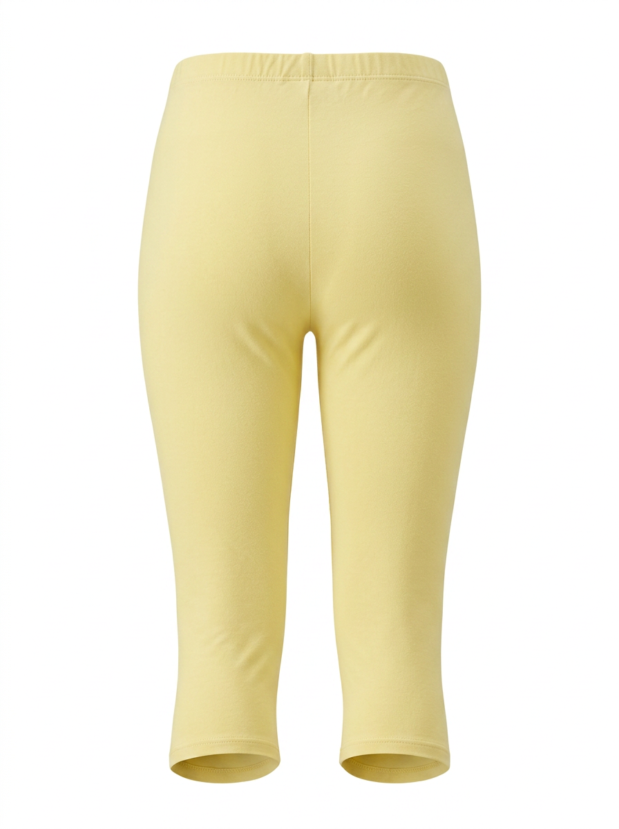 Ghost image of a light-yellow HIGH WAISTED BASIC CAPRI LEGGING on a white background. 