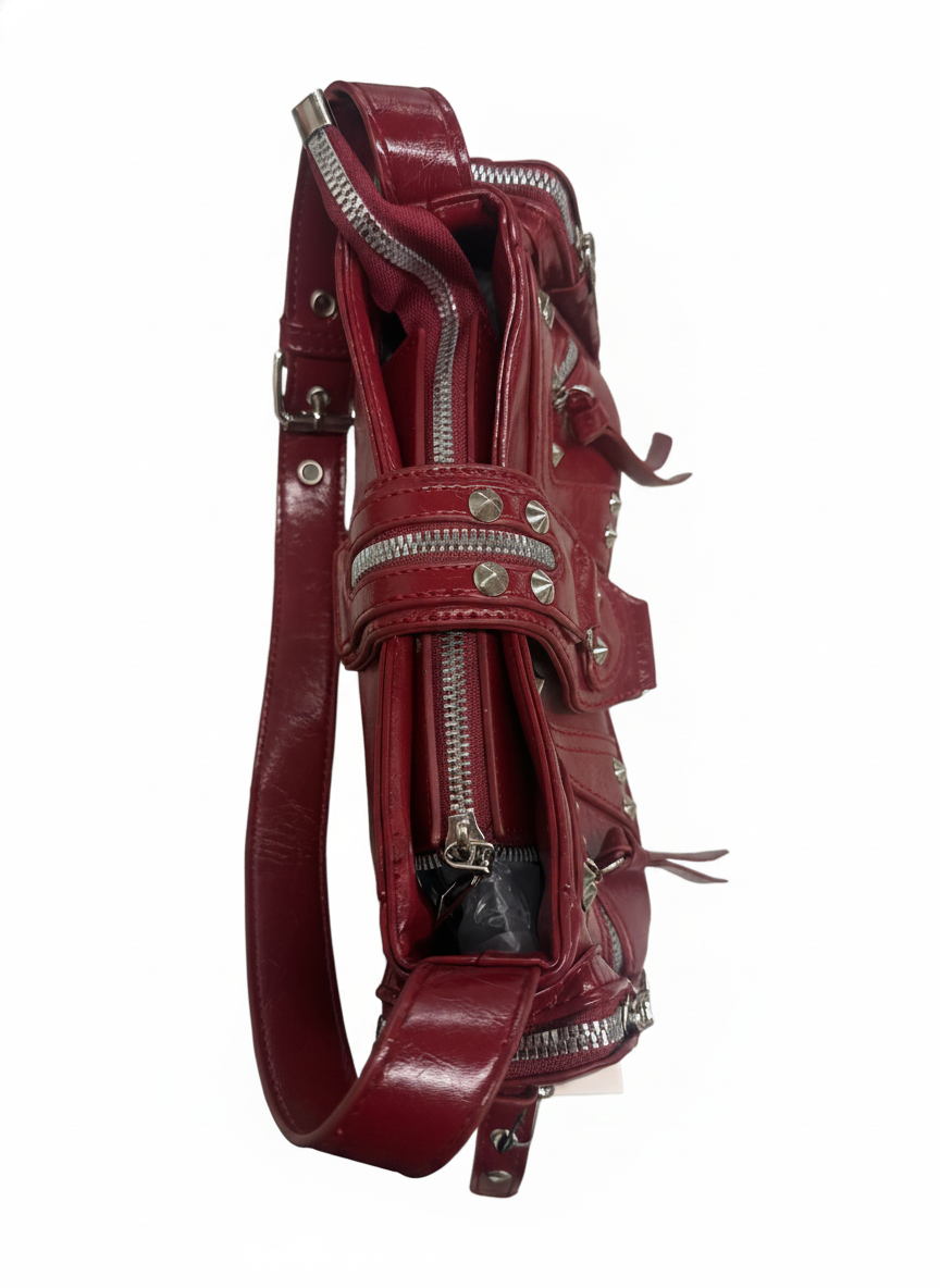 STUDDED RIVET AND MULTI ZIPPER VEGAN LEATHER BAG